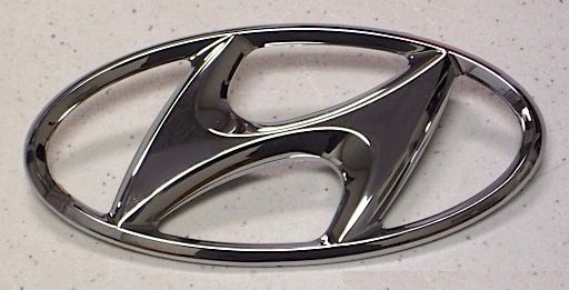 Эмблема решетки радиатора HYUNDAI Elantra '06-, Getz, Grandeur, i20, i30, ix55, Matrix, Sonata, Terracan, Trajet, Tucson, Veracruz 863002E000 863003A000 863003A001 Hyundai/Kia